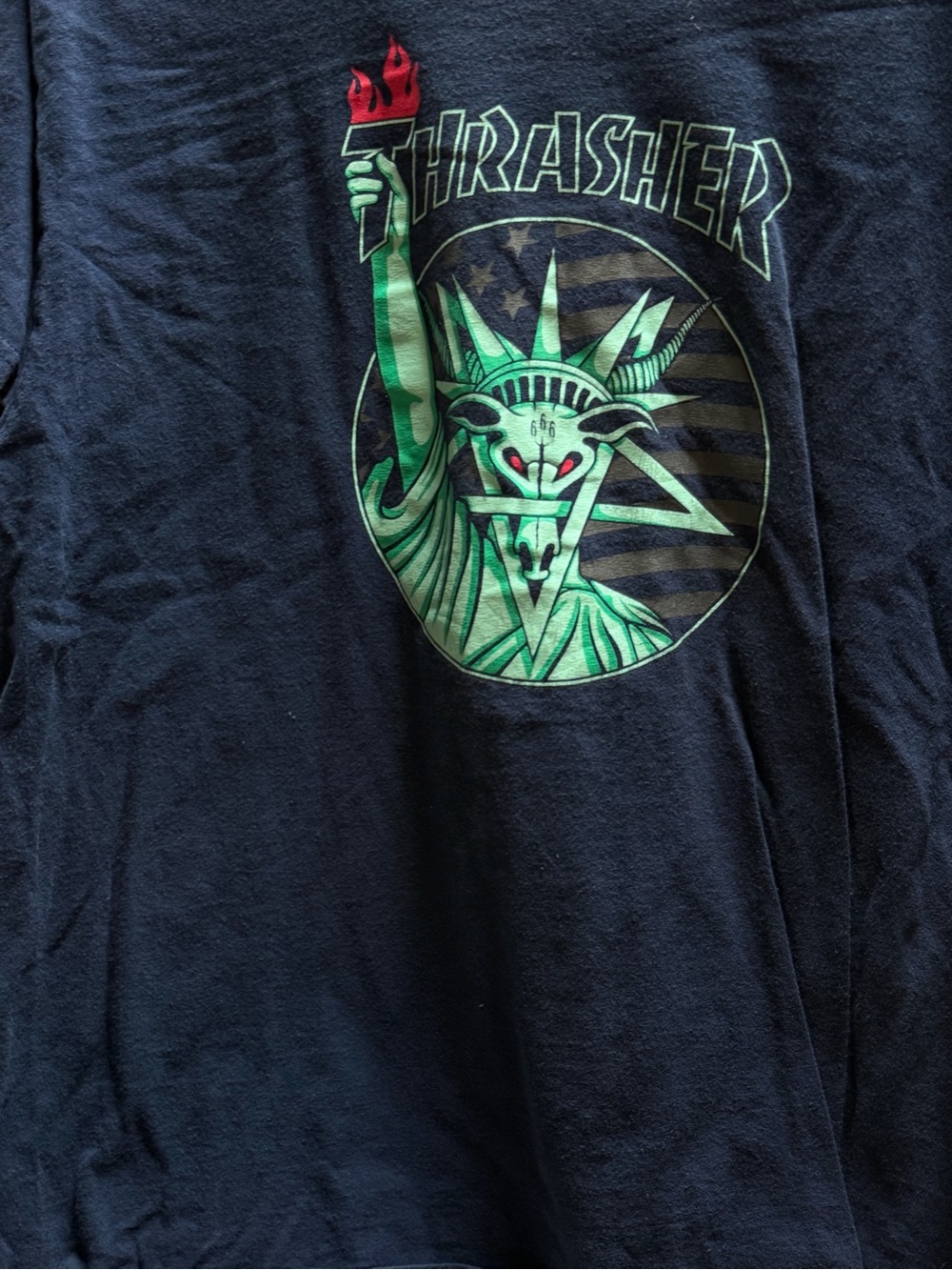 Thrasher Black Tee with Green Statue Graphic and Red Torch